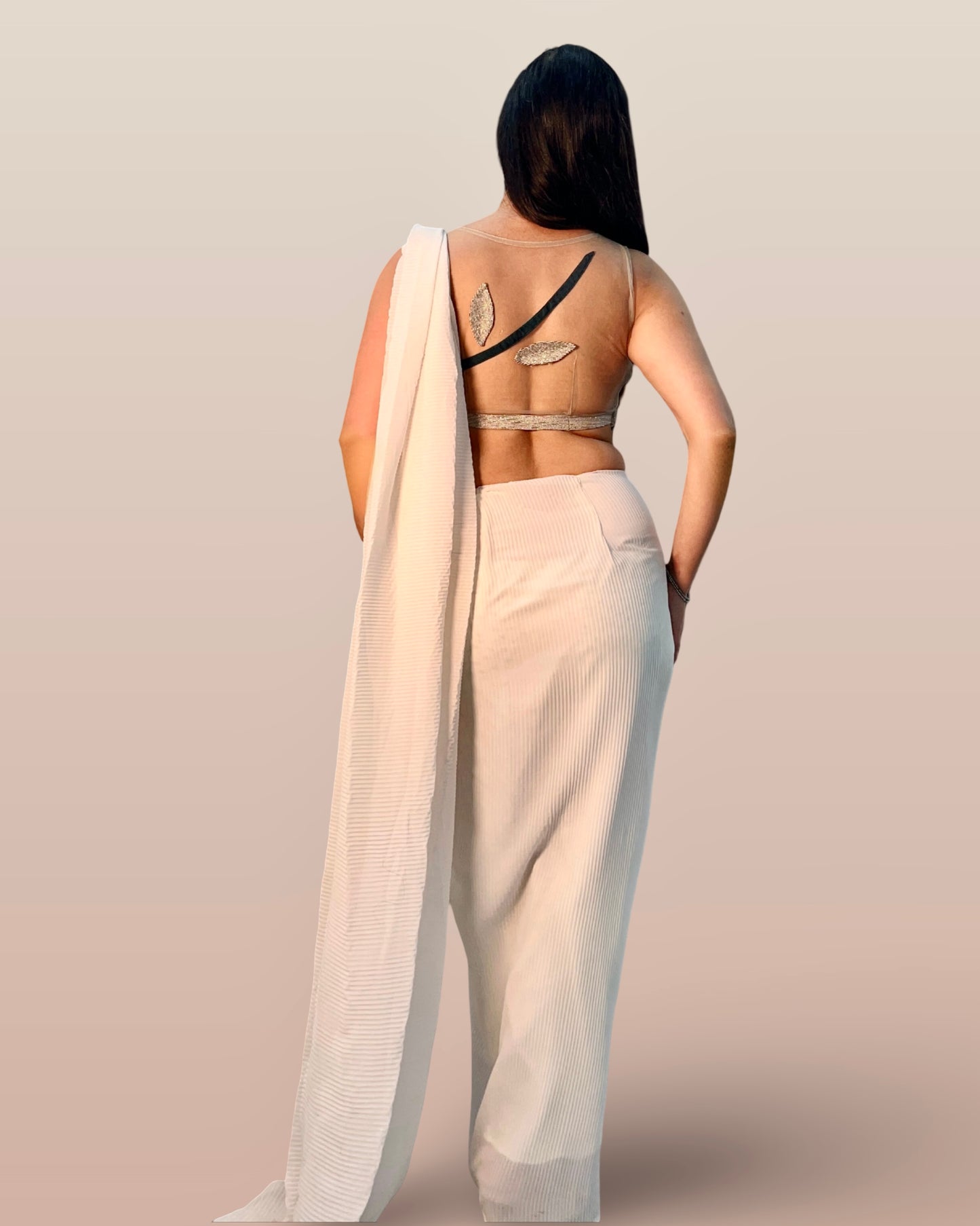 Draped off white saree inspired ensemble in pleated georgette fabric