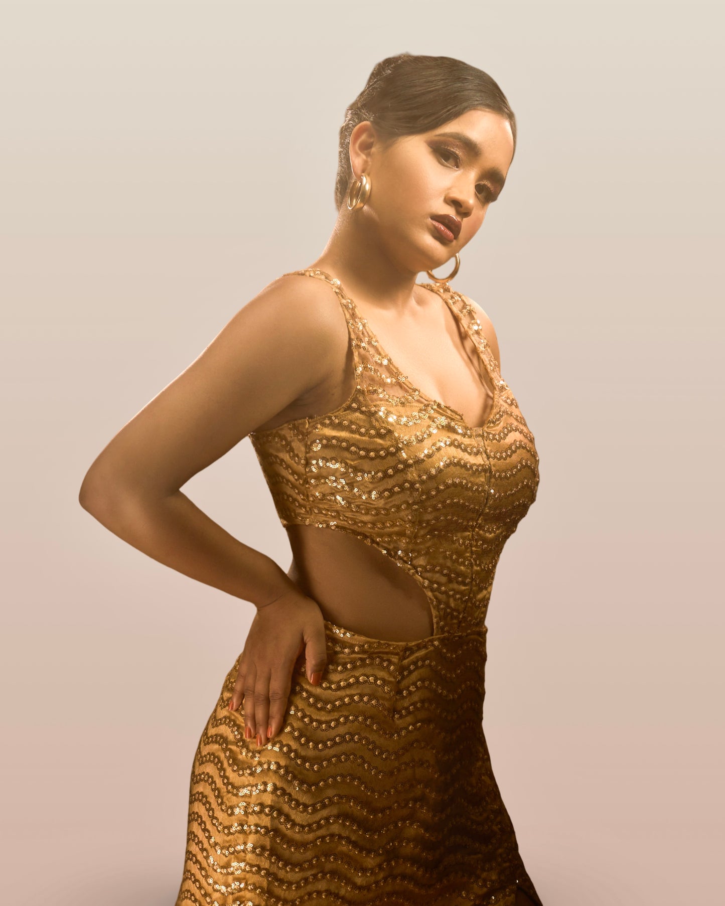 Golden embroidered and sequins embellished party wear evening gown
