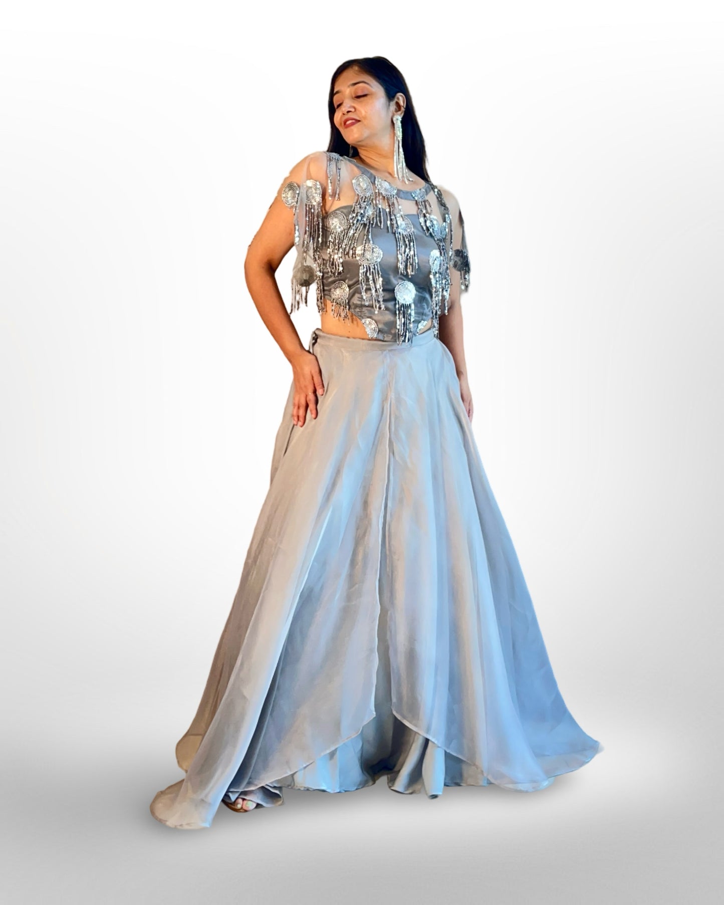 Layered full flared lehnga in organza with embellished net top