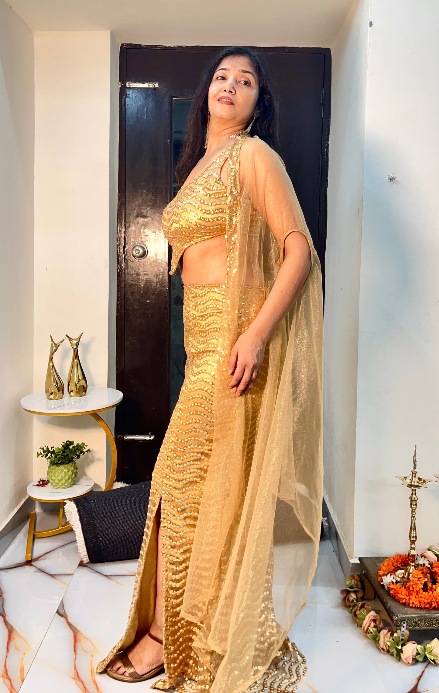 Golden party wear embroidered ensemble in net fabric