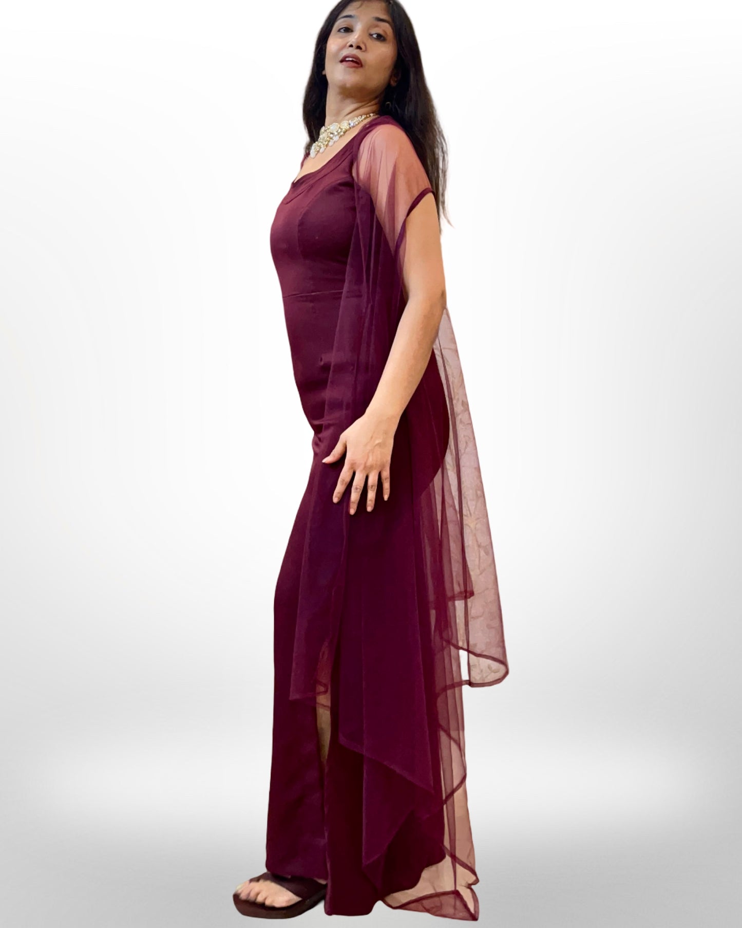 Wine colour stretchable evening gown with sheer net cape