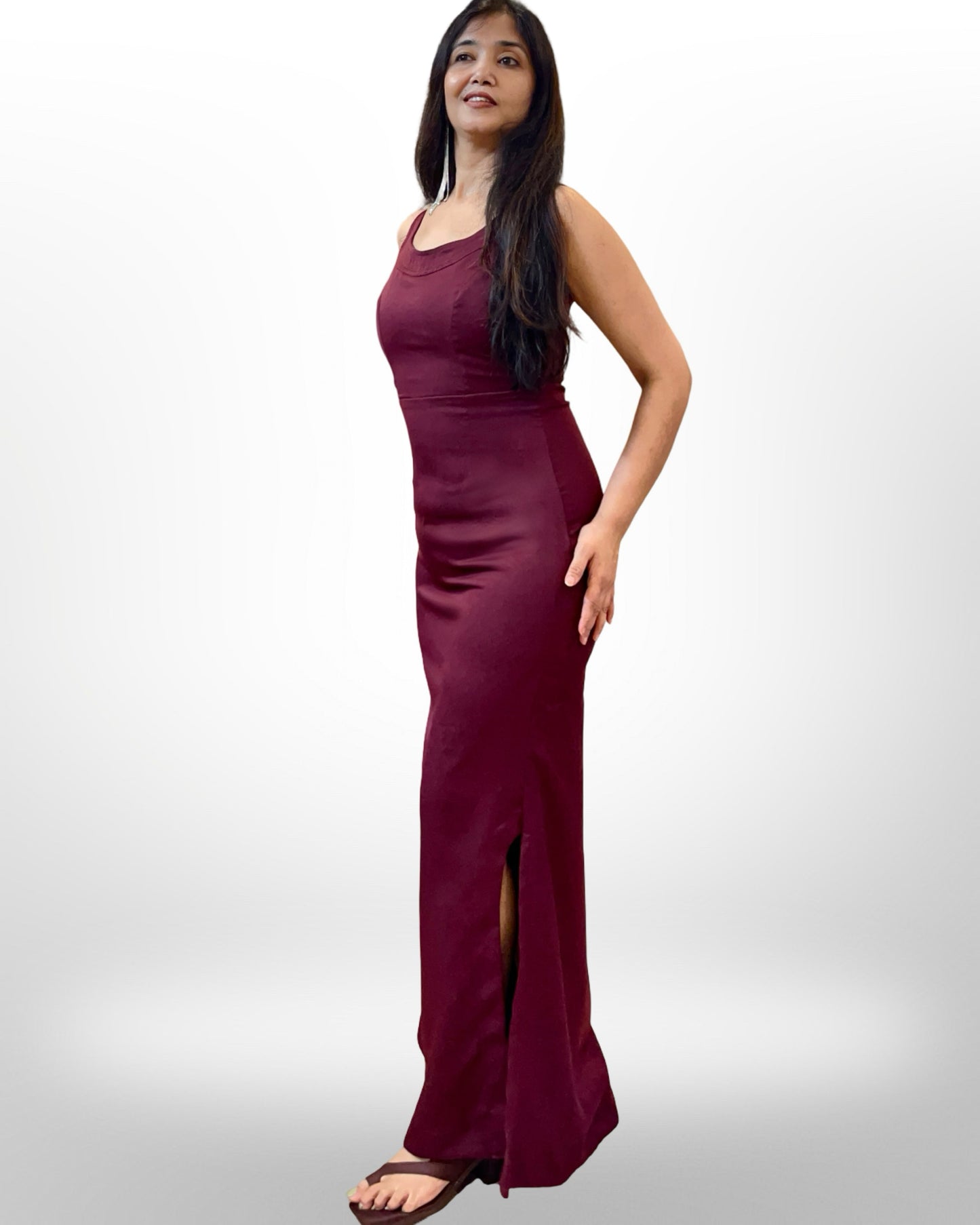 Wine colour stretchable evening gown with sheer net cape